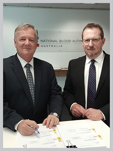 a photo of NBA's Mr John Cahill, Chief Executive and Mr Michael Stone, Deputy General Manager and General Counsel signing the new contract with CSL Behring Australia